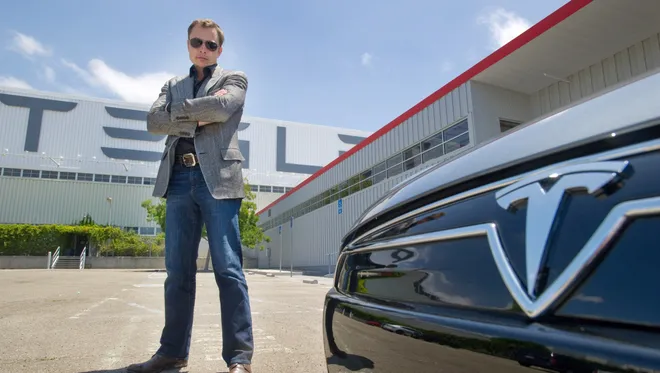Elon musk and a tesla -The unbelievable Journey of Tesla