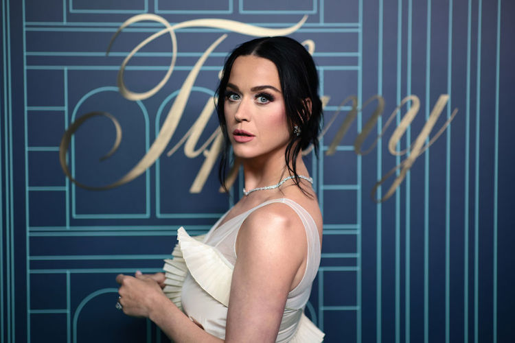 A white woman putting white gown with black hair